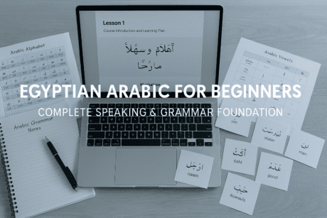 Study desk with Arabic notes, vocabulary cards, phonetic guides and a laptop showing Egyptian Arabic lessons for Egyptian Arabic Beginners.